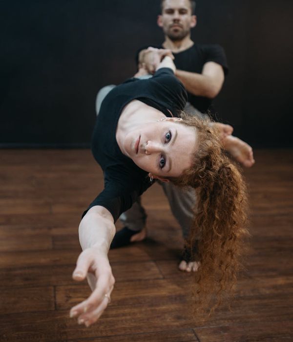 Man performing a controlled strength exercise with intense focus.